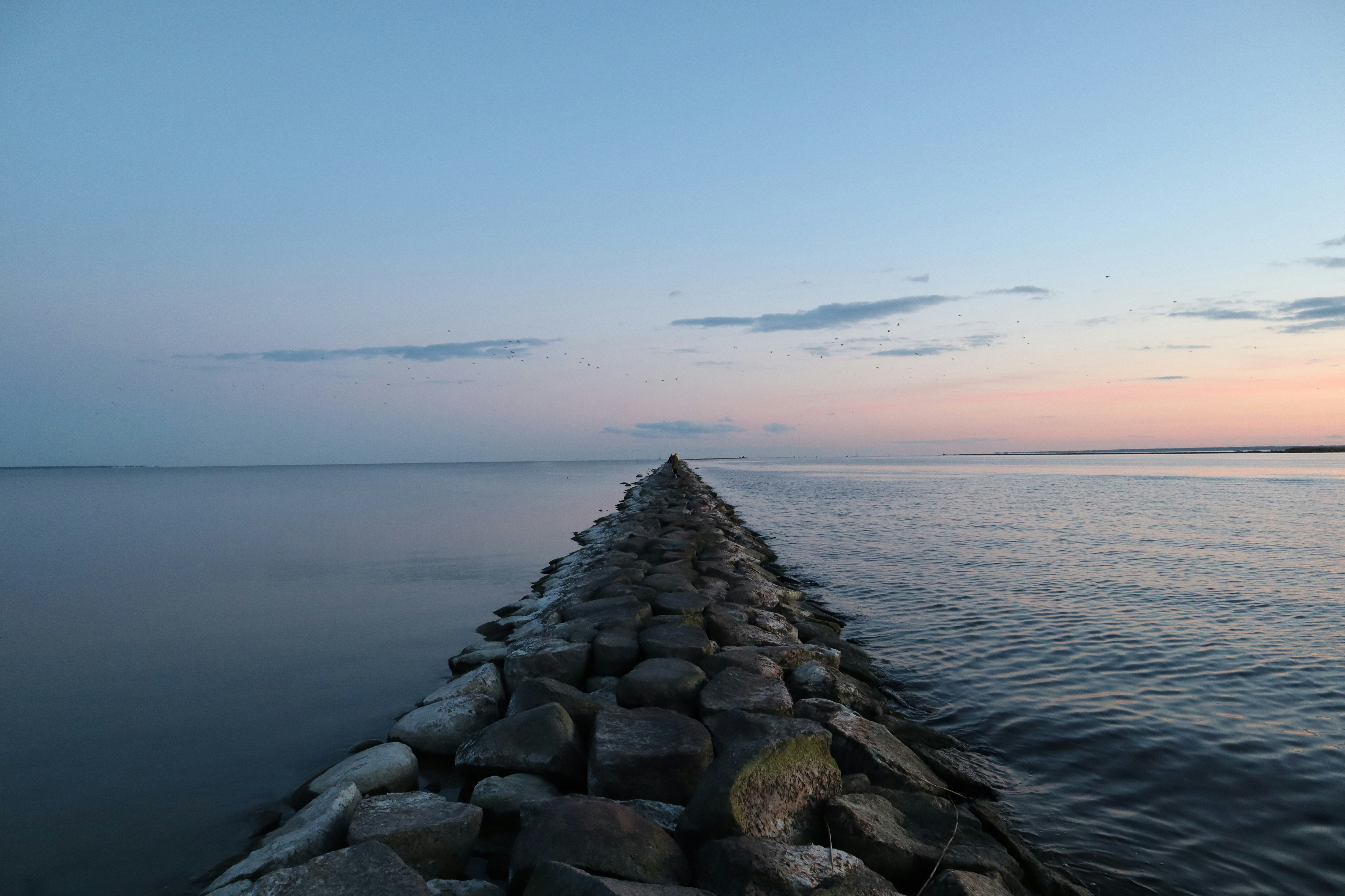 gray rocks near body of water during daytime, 