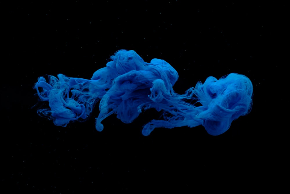 blue smoke on black background