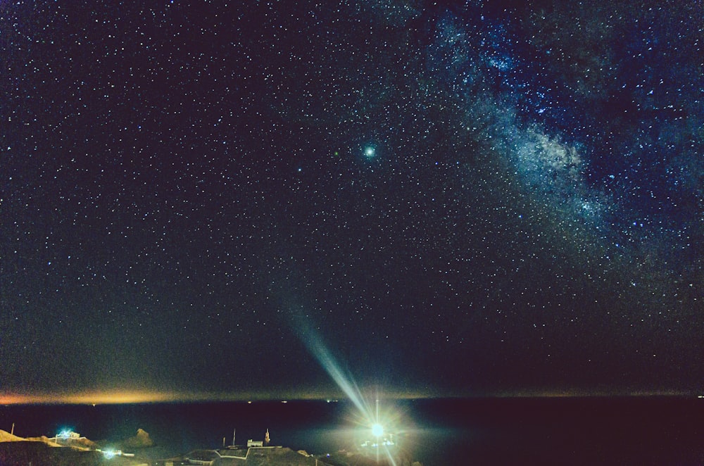 body of water under starry night