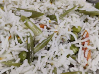 Close-up of fragrant basmati rice mixed with tender chicken pieces and spices.