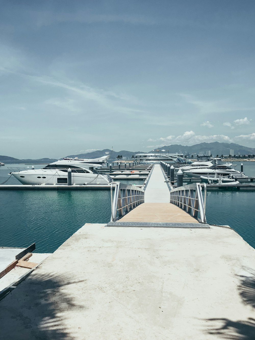 brown wooden dock on body of water during daytime