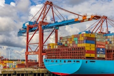 blue and red cargo ship