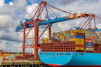 blue and red cargo ship