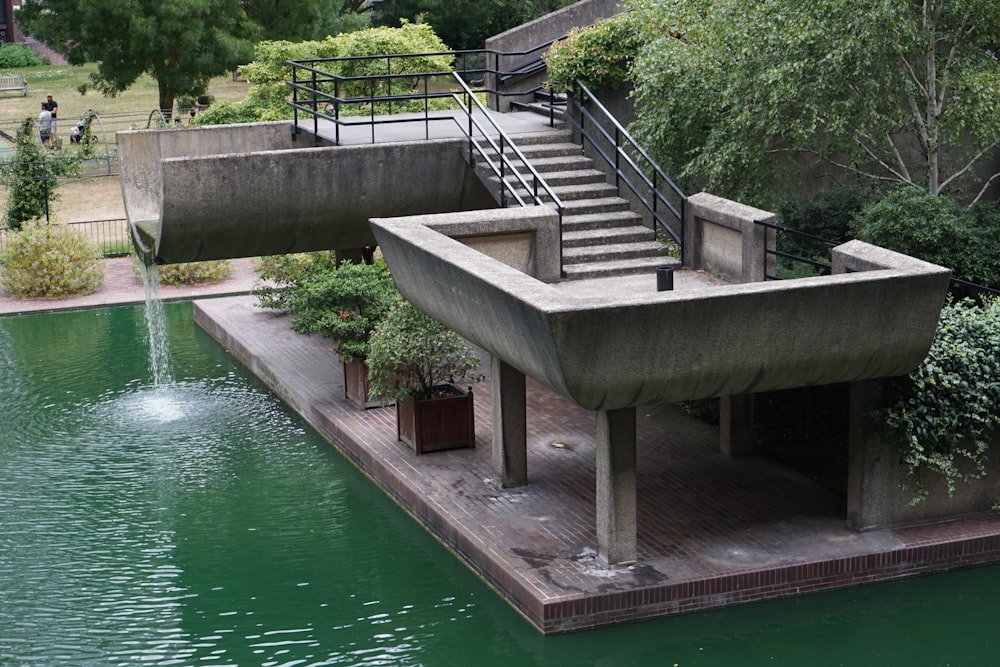 gray concrete bridge over river