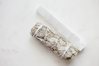 a roll of white sage sitting on top of a counter