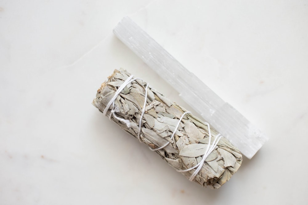 a roll of white sage sitting on top of a counter