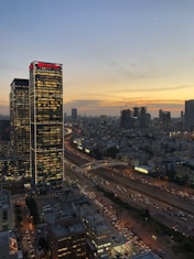 a very tall building sitting in the middle of a city