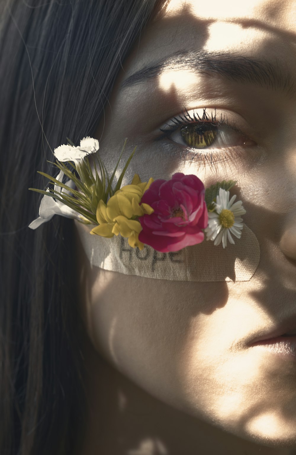 woman with white and pink flower on her ear