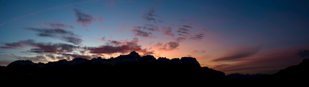 silhouette of mountain under blue sky during sunset