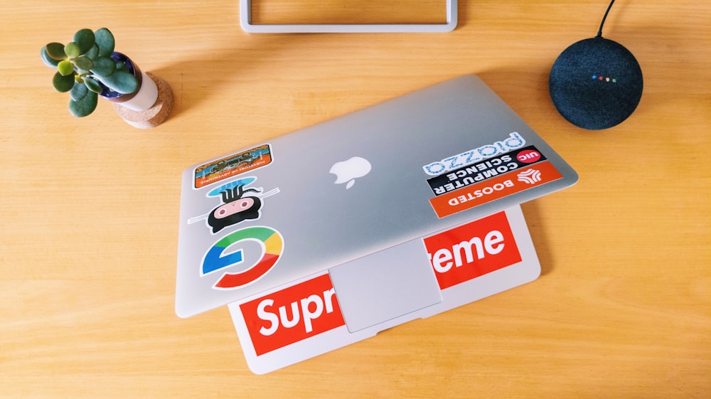 macbook pro on brown wooden table