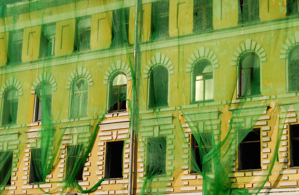 green concrete building during daytime