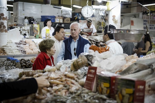 people in a market during daytime