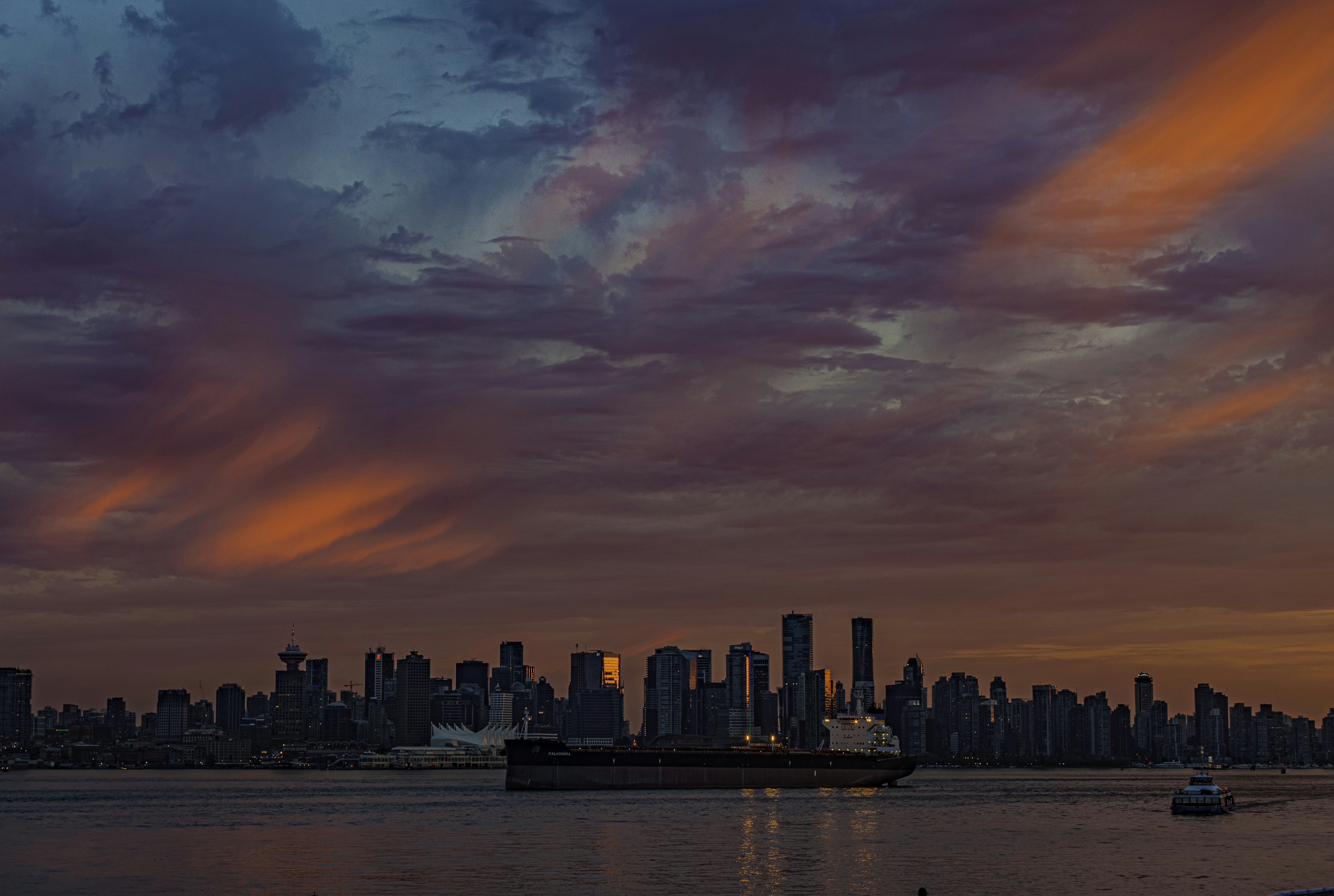 Stunning city view from a River North rooftop at sunset, with the Chicago skyline illuminated. - bars in river north chicago il