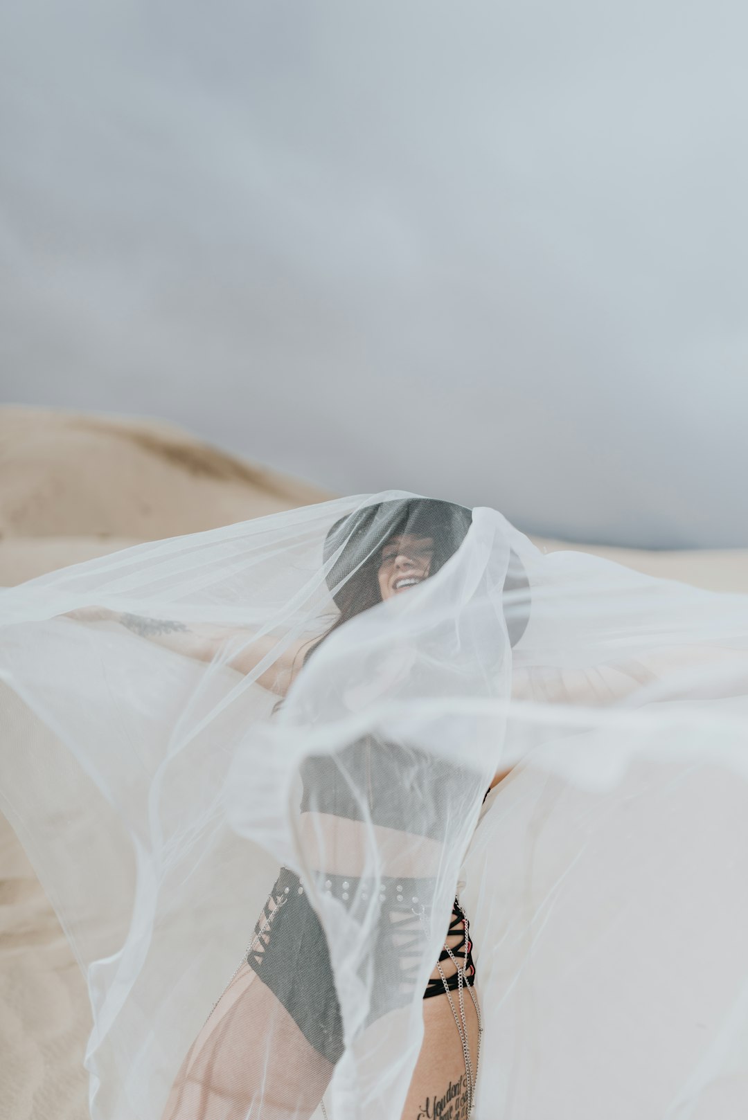 woman in white hijab on desert