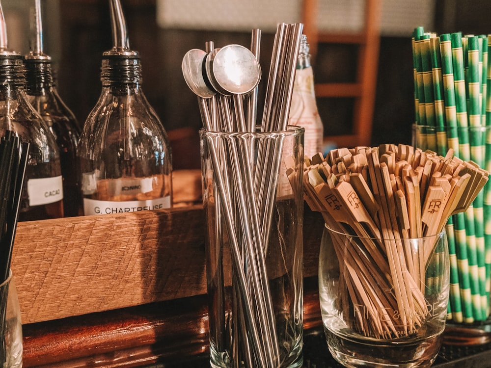 stainless steel spoons on brown wooden table