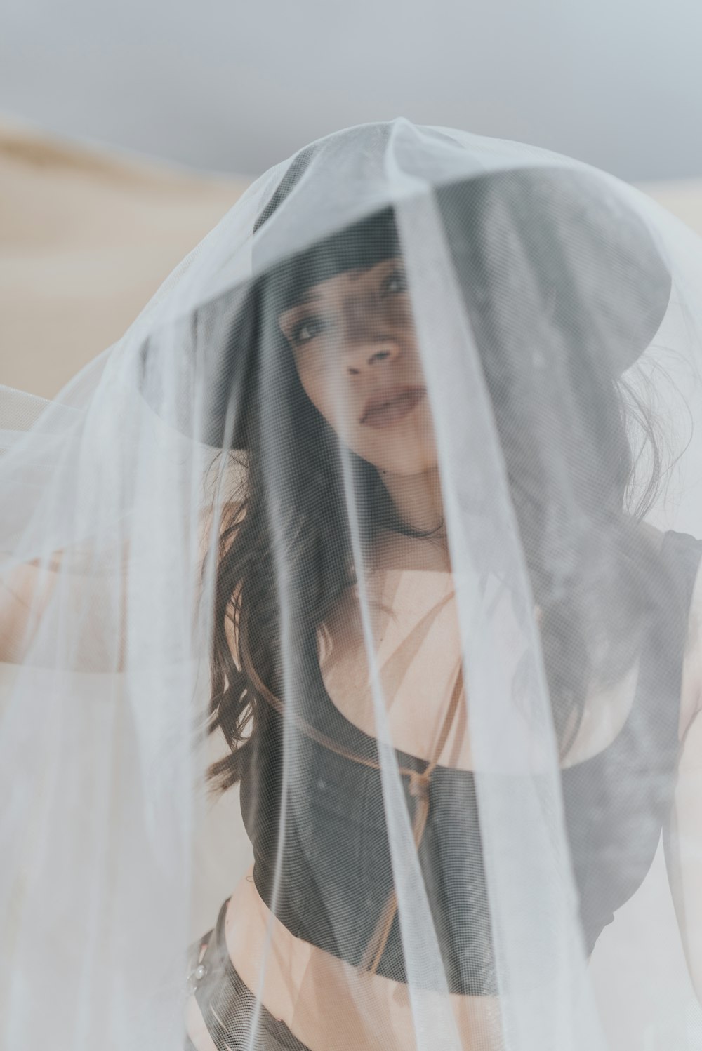 woman in white veil and black long sleeve shirt