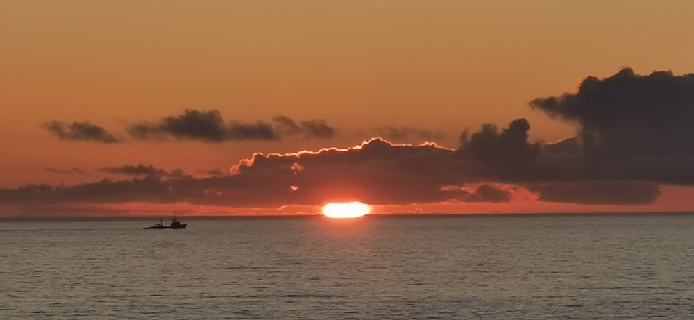 body of water during sunset