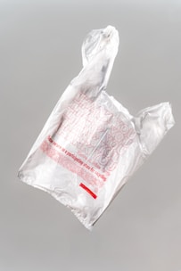 white plastic bag on white table