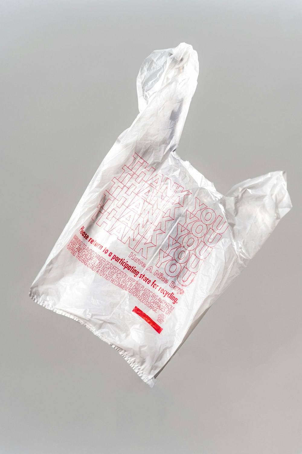 white plastic bag on white table