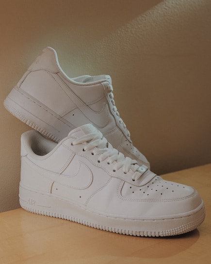 A clean and restored pair of sneakers displayed elegantly.