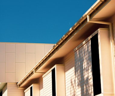 brown concrete building under blue sky during daytime