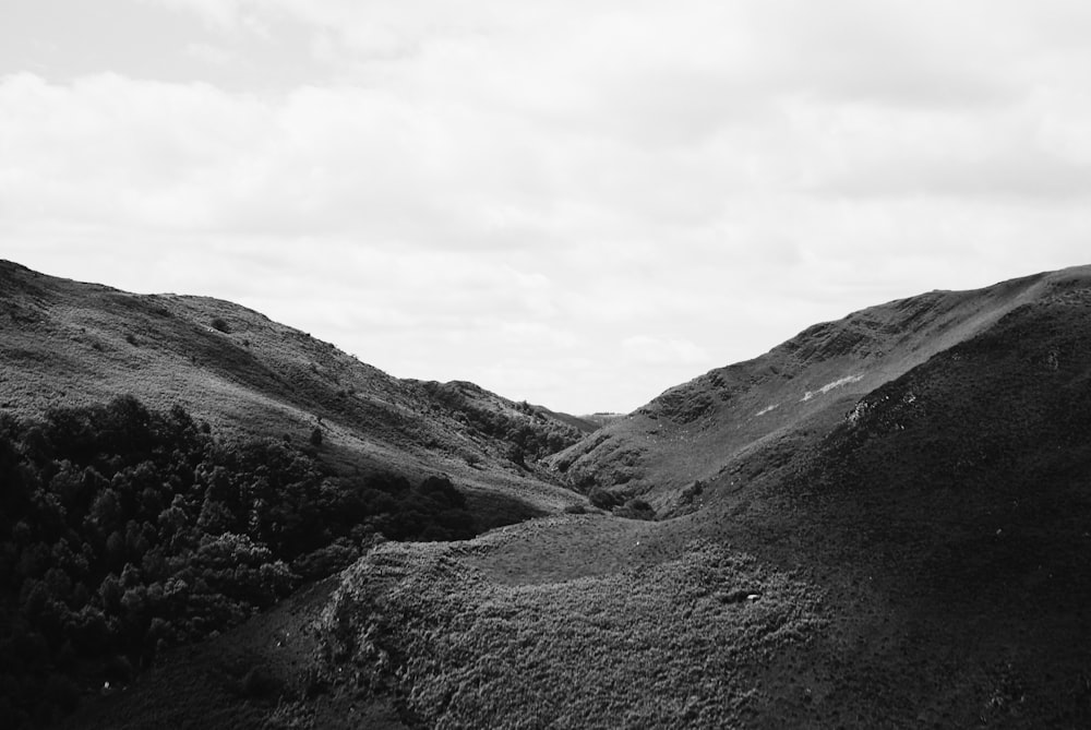 a black and white photo of a mountain range