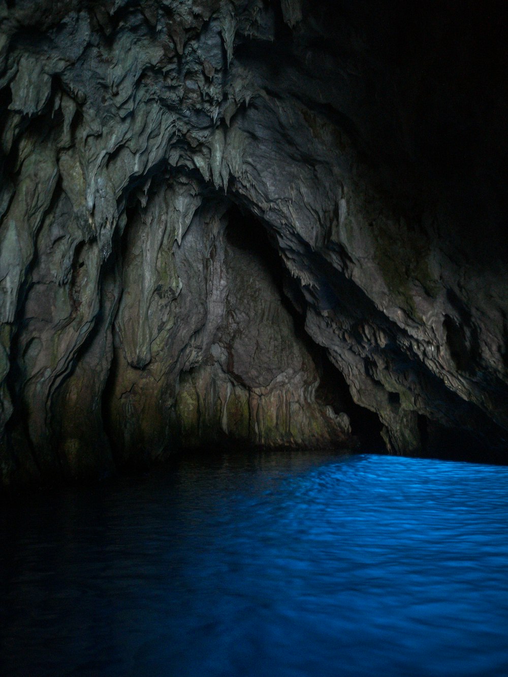 gray rock formation on blue sea water during daytime