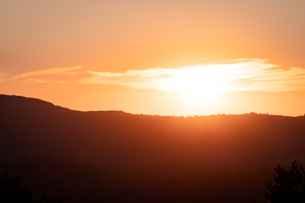 silhouette of mountains during sunset