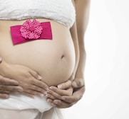 pregnant woman in white skirt