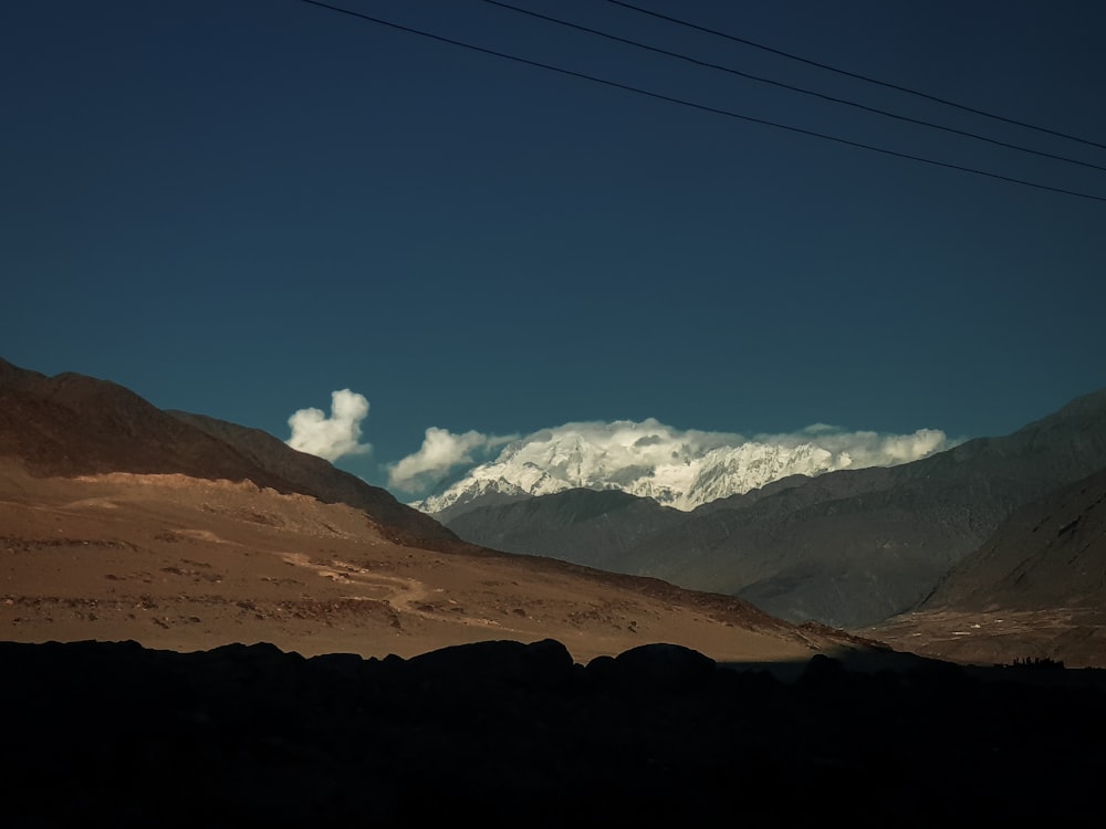 brown mountains under blue sky during daytime