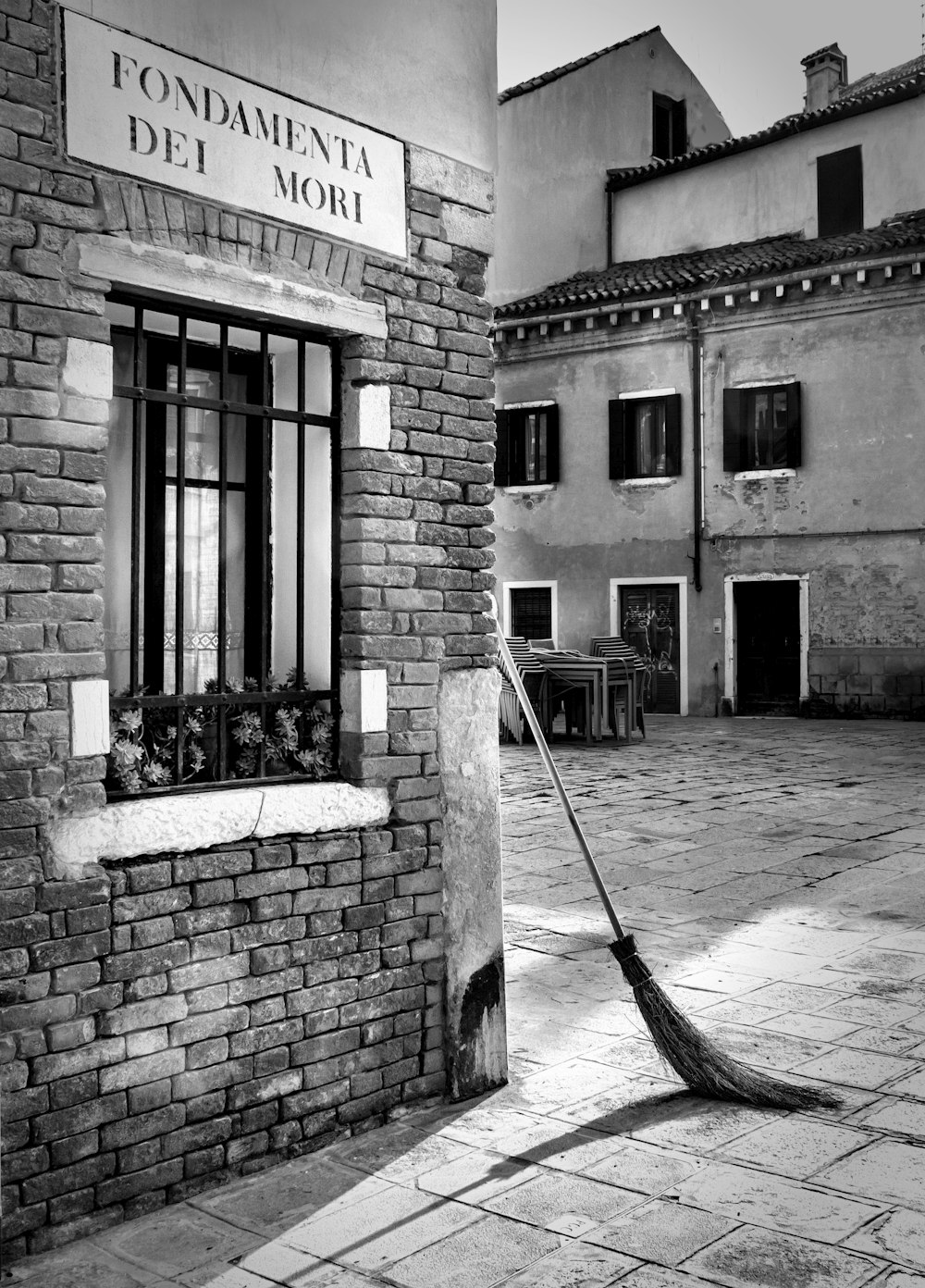 grayscale photo of brick building