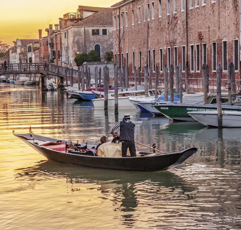 people riding on boat on river during daytime