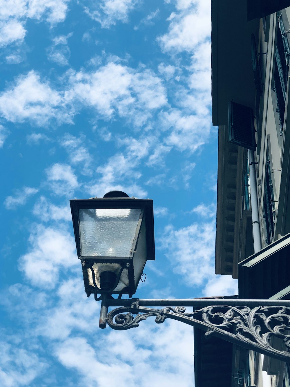 black street light under blue sky during daytime