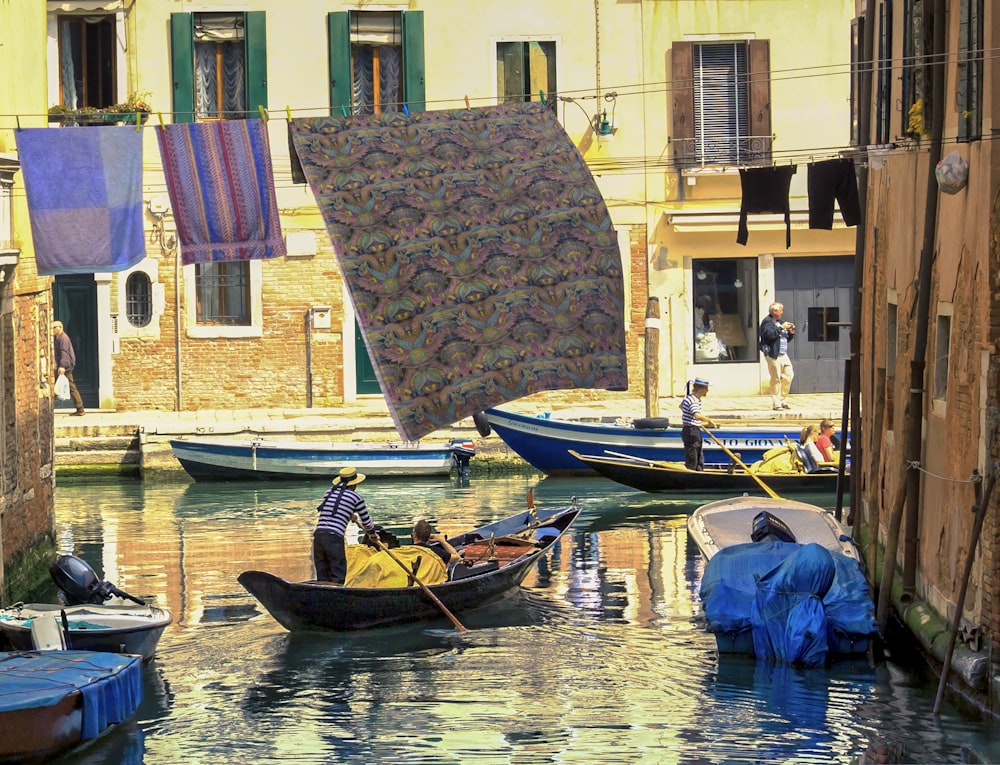 brown and white boat on body of water during daytime