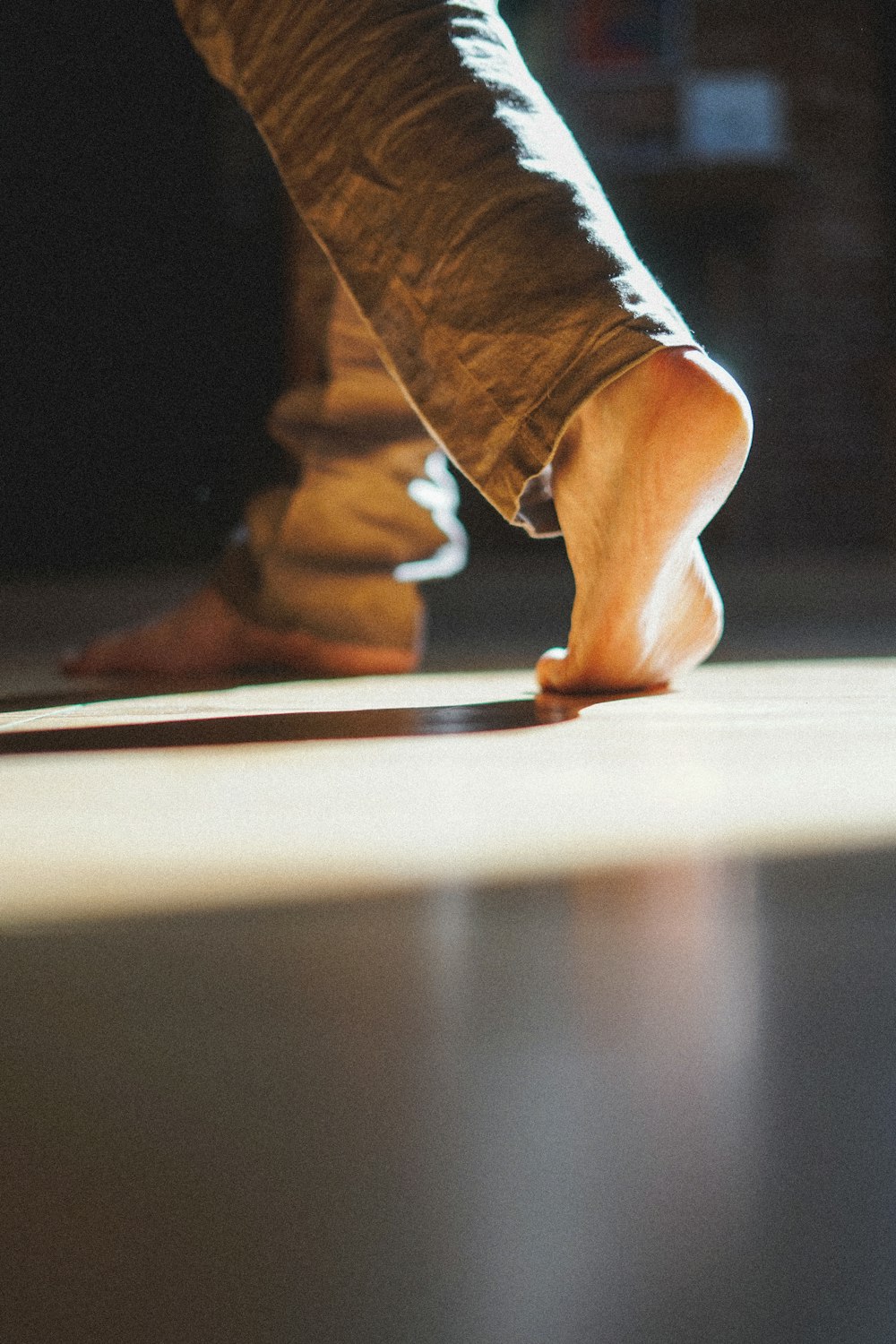 person in blue denim jeans and brown shoes