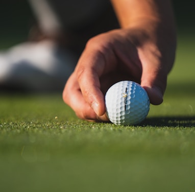 white golf ball on green grass field