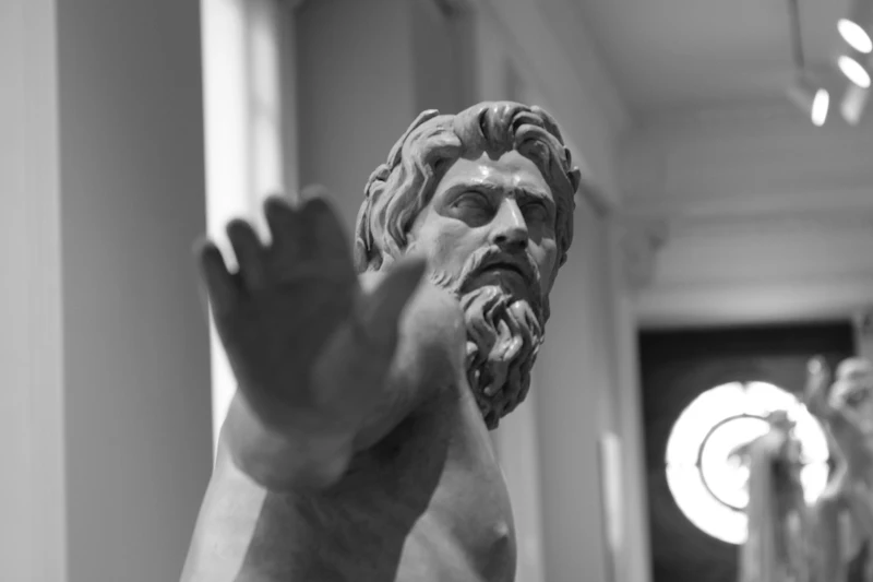 Ancient Greek statue of Zeus with lightning bolt
