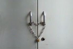 black framed eyeglasses on white surface