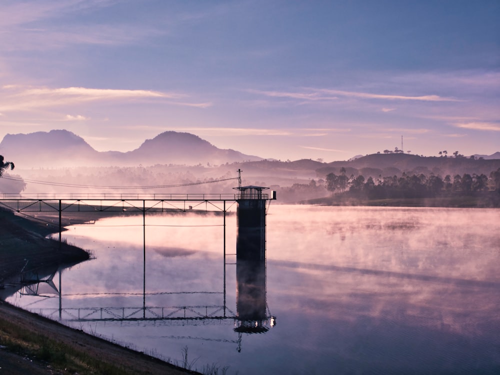 gray concrete bridge over river during daytime