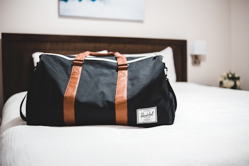 black and brown leather tote bag