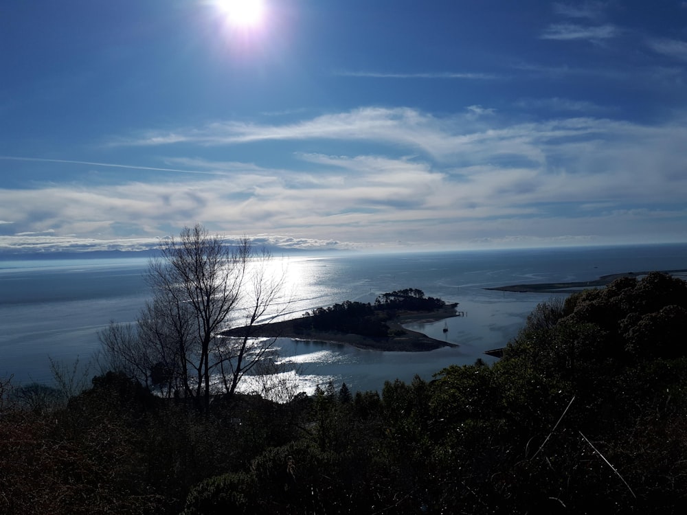 body of water under blue sky during daytime