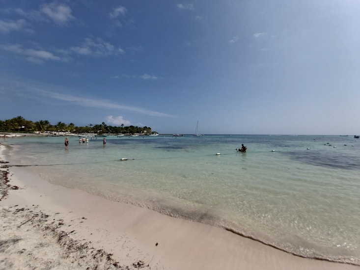 Snorkeling in clear water in Akumal Bay Mexico