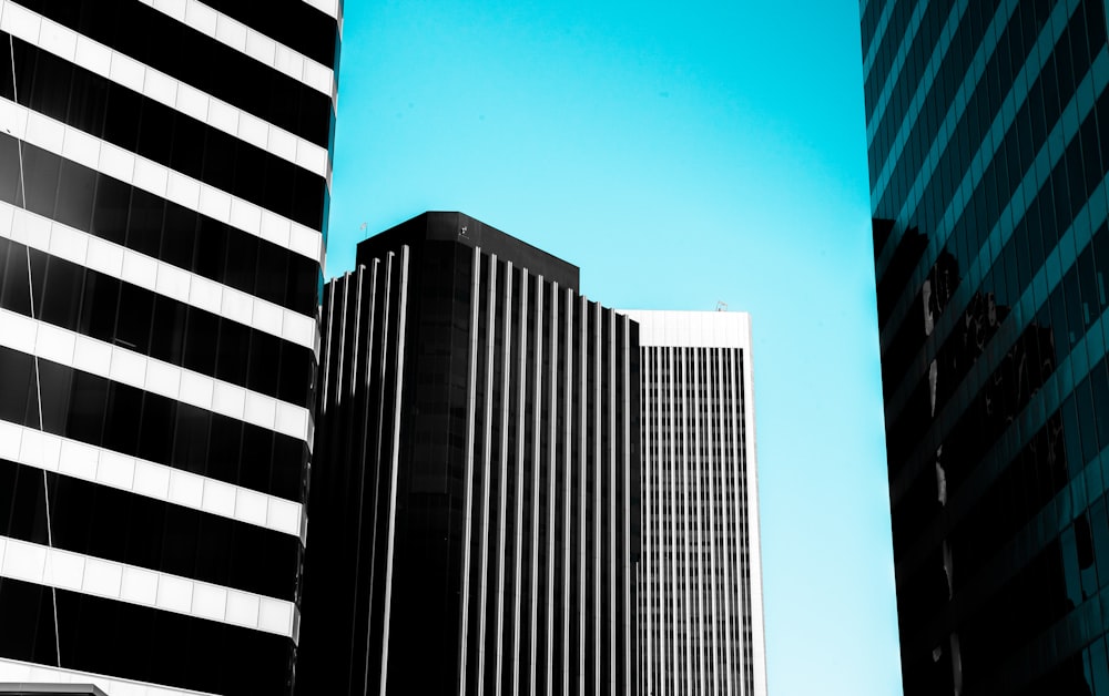 white and black concrete building under blue sky during daytime