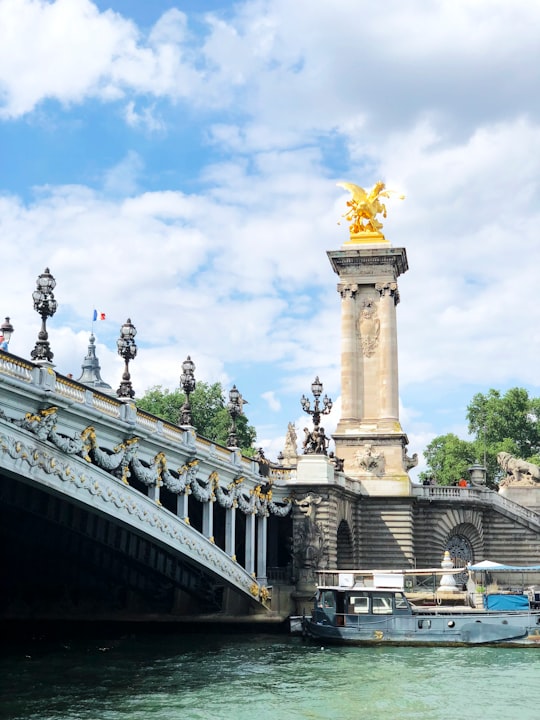 white concrete building under blue sky during daytime in Pont Alexandre III France