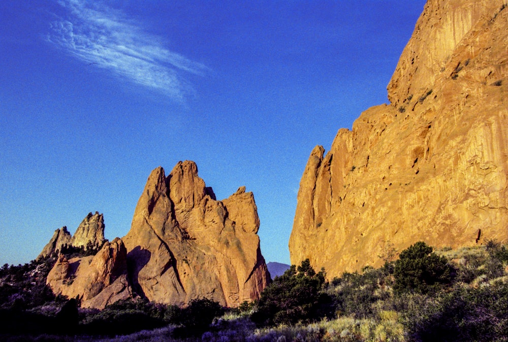 brown rock formation under blue sky during daytime