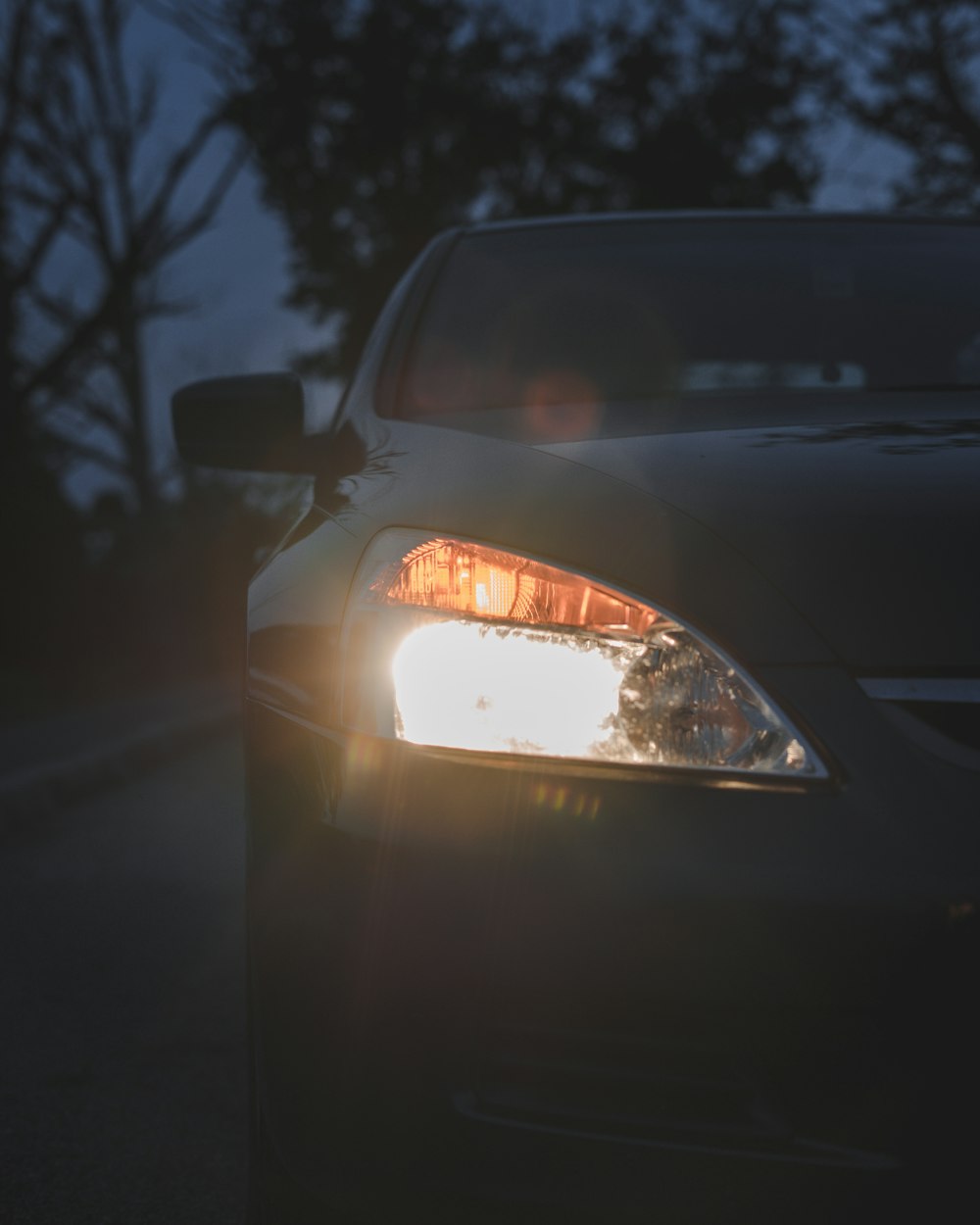 white car on road during night time