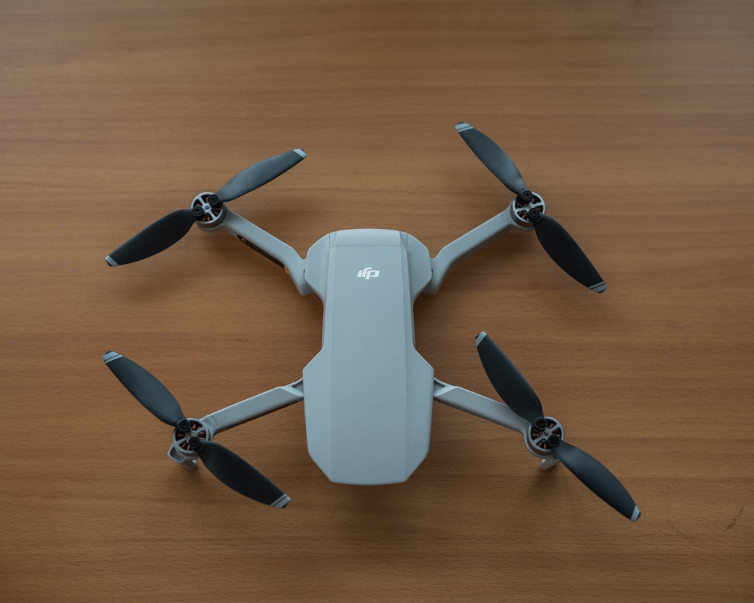 white and gray quadcopter drone