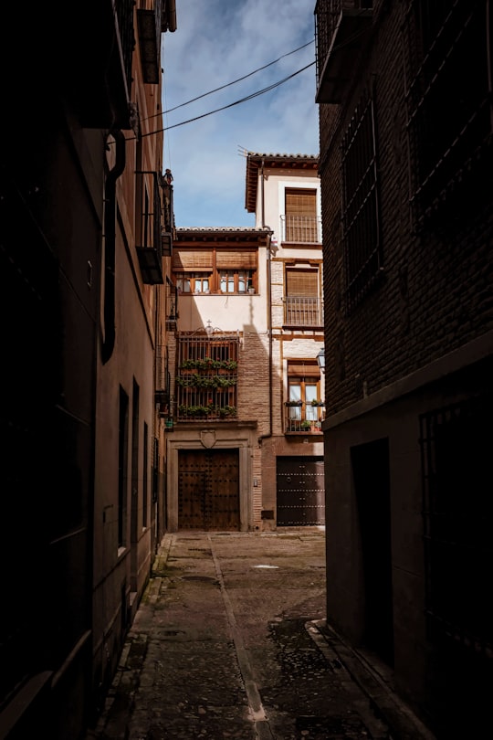 brown concrete building during daytime in Toledo Spain