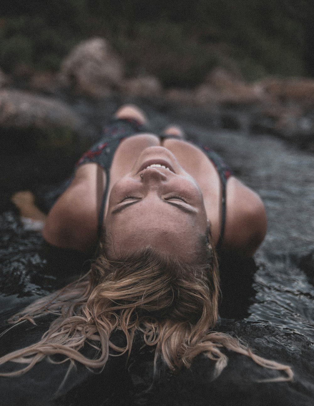 woman in blue and red bikini top in water