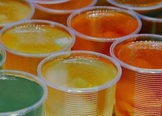 clear glass jars with yellow liquid